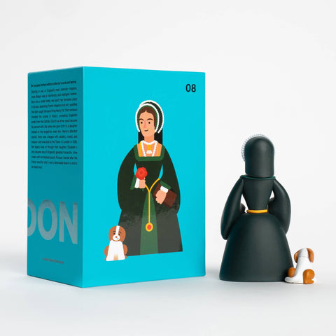 Dark green figurine of Anne Boleyn with a dog next to its packaging box on a white background