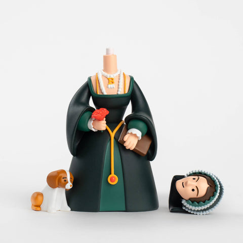 Figurine of Anne Boleyn in a dark green dress with a dog and another figure on a white background