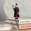 Sherlock Holmes collectible figure displayed beside books
