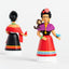 Two Frida Kahlo collectible figures shown from back and front views