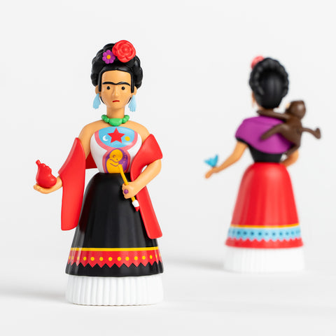 Two Frida Kahlo collectible figures shown from front and back views